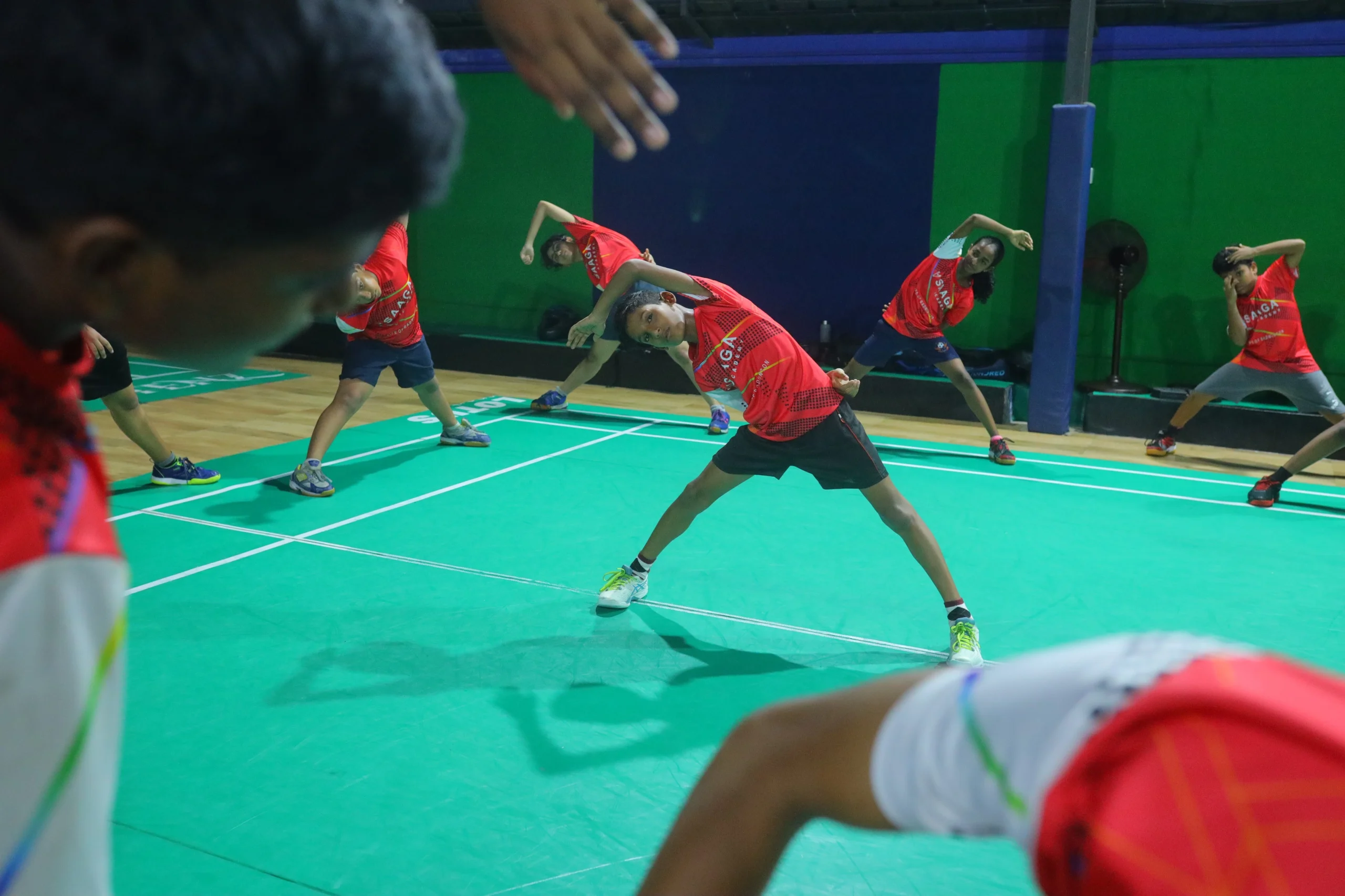 Badminton player practising on court at Saaga